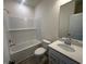 Well-lit bathroom features white subway tile in shower/tub, white vanity with quartz countertop and a large mirror at 553 Honeyhill Loop, Conway, SC 29526