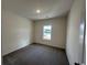 Empty bedroom featuring neutral walls, carpeted floors, one window and overhead lighting at 553 Honeyhill Loop, Conway, SC 29526