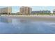Beach view of buildings along the coastline with people sunbathing at 5600 North Ocean Blvd. # B-3, North Myrtle Beach, SC 29582