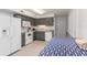 Bright kitchen with gray cabinets and white appliances adjacent to the dining area at 5600 North Ocean Blvd. # B-3, North Myrtle Beach, SC 29582