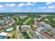 Sprawling aerial view of the neighborhood, showcasing lush green trees and well-maintained properties at 5750 Oyster Catcher Dr. # 1135, North Myrtle Beach, SC 29582