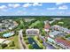Wide aerial view of the community featuring multiple pools, condos, and a golf course at 5750 Oyster Catcher Dr. # 1135, North Myrtle Beach, SC 29582
