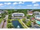Aerial view of the condo complex with lush greenery, trees, and well-manicured lawns at 5750 Oyster Catcher Dr. # 1135, North Myrtle Beach, SC 29582