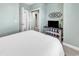 Nicely decorated bedroom with multiple closets and a TV on display at 5750 Oyster Catcher Dr. # 1135, North Myrtle Beach, SC 29582