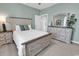 Cozy bedroom features a beautifully appointed bedroom set and soft, natural light at 5750 Oyster Catcher Dr. # 1135, North Myrtle Beach, SC 29582