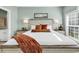 Comfortable bedroom with a bed and an ensuite bathroom illuminated by natural light at 5750 Oyster Catcher Dr. # 1135, North Myrtle Beach, SC 29582