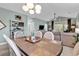 Inviting dining area adjacent to the living room, featuring a stylish table and seating, perfect for Gathering meals at 5750 Oyster Catcher Dr. # 1135, North Myrtle Beach, SC 29582