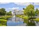 Beautiful condo building overlooking a pond with a fountain and lush landscaping at 5750 Oyster Catcher Dr. # 1135, North Myrtle Beach, SC 29582