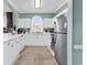 Well-maintained kitchen featuring white cabinetry, modern appliances, and an arched window that provides natural light at 5750 Oyster Catcher Dr. # 1135, North Myrtle Beach, SC 29582