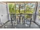 Enclosed patio with a table and chairs, offering outdoor scenery at 5750 Oyster Catcher Dr. # 1135, North Myrtle Beach, SC 29582