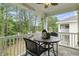 Relaxing balcony with ceiling fan and cafe style seating overlooking wooded area at 5825 Catalina Dr. # 1034, North Myrtle Beach, SC 29582