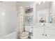 Bright bathroom features a tub/shower combo and single sink vanity at 5825 Catalina Dr. # 1034, North Myrtle Beach, SC 29582