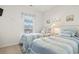 Bright and airy bedroom featuring twin beds, beach decor, and a window at 5825 Catalina Dr. # 1034, North Myrtle Beach, SC 29582