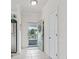 Inviting entrance showcases neutral tile flooring and a door leading to a patio area at 5825 Catalina Dr. # 1034, North Myrtle Beach, SC 29582