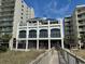 Unique building exterior featuring striking architectural details, balconies, and beautiful windows at 5825 Catalina Dr. # 1034, North Myrtle Beach, SC 29582