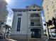 Exterior view of beach cabana showcasing architectural details, balcony and adjacent parking at 5825 Catalina Dr. # 1034, North Myrtle Beach, SC 29582