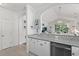 Kitchen and living room are visible from the granite countertops at 5825 Catalina Dr. # 1034, North Myrtle Beach, SC 29582