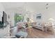 Bright living room featuring vaulted ceiling, sliding glass doors to a balcony, and beach themed decor at 5825 Catalina Dr. # 1034, North Myrtle Beach, SC 29582
