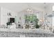Bright living room featuring vaulted ceiling, orb chandelier, and beach themed decor throughout at 5825 Catalina Dr. # 1034, North Myrtle Beach, SC 29582
