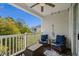 Inviting balcony with comfortable seating, ceiling fan and beautiful treetop views at 6015 Catalina Dr. # 132, North Myrtle Beach, SC 29582