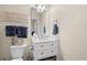 Clean bathroom with a white vanity, toilet, and light fixture that enhances the neutral wall paint at 6015 Catalina Dr. # 132, North Myrtle Beach, SC 29582