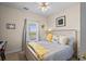 Cozy bedroom featuring natural light, a wooden bed frame, and decor that creates a peaceful ambiance at 6015 Catalina Dr. # 132, North Myrtle Beach, SC 29582