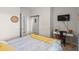 Contemporary bedroom featuring a workspace, TV, mirrored closet and a comfortable bed, creating a versatile area at 6015 Catalina Dr. # 132, North Myrtle Beach, SC 29582