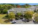 Aerial view of building with well manicured grounds and ample parking at 6015 Catalina Dr. # 132, North Myrtle Beach, SC 29582