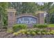 Arbor Trace community entrance sign surrounded by colorful flowers and landscaping at 6015 Catalina Dr. # 132, North Myrtle Beach, SC 29582