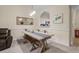Charming dining area features a rustic wooden table and bench, perfect for casual meals and gatherings at 6015 Catalina Dr. # 132, North Myrtle Beach, SC 29582