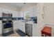 Well-equipped kitchen features white cabinets, subway tile backsplash, and stainless steel appliances at 6015 Catalina Dr. # 132, North Myrtle Beach, SC 29582