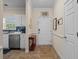 Kitchen doorway with stainless steel appliances and entryway with a table and decor at 6015 Catalina Dr. # 132, North Myrtle Beach, SC 29582