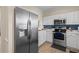 Modern kitchen offers stainless steel appliances, white cabinetry, and sleek countertops at 6015 Catalina Dr. # 132, North Myrtle Beach, SC 29582