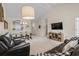 Living room open to the dining area and kitchen with comfortable leather seating and a TV at 6015 Catalina Dr. # 132, North Myrtle Beach, SC 29582