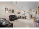 Open-concept living room boasts vaulted ceilings and comfortable seating, seamlessly flowing into the dining area at 6015 Catalina Dr. # 132, North Myrtle Beach, SC 29582