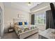 Calm main bedroom with tray ceiling, large window, neutral tones, and soft, inviting decor at 6015 Catalina Dr. # 132, North Myrtle Beach, SC 29582