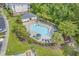 Aerial view of community pool with ample seating, lush landscaping and a pool house at 6015 Catalina Dr. # 132, North Myrtle Beach, SC 29582