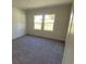Cozy bedroom with soft carpeting and a window providing natural light at 605 Muster Field Ct., Conway, SC 29526