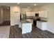 Modern kitchen boasts stainless steel appliances, granite countertops, and a functional center island at 605 Muster Field Ct., Conway, SC 29526