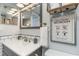 Clean bathroom with modern fixtures, stylish tilework, and a humorous 