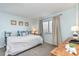 Cozy bedroom with a full bed, ocean-themed decor, and a window bringing in natural light at 6100 N Ocean Blvd. # 804, North Myrtle Beach, SC 29582
