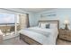 Cozy bedroom features a balcony with ocean views and neutral decor creating a serene and relaxing space at 6100 N Ocean Blvd. # 804, North Myrtle Beach, SC 29582