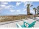 Beachside deck with Adirondack chairs, providing beautiful ocean views at 6100 N Ocean Blvd. # 804, North Myrtle Beach, SC 29582
