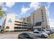 Multi-story condo building with parking garage in front at 6100 N Ocean Blvd. # 804, North Myrtle Beach, SC 29582