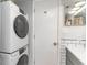 Laundry closet with stacked washer and dryer at 6100 N Ocean Blvd. # 804, North Myrtle Beach, SC 29582