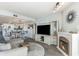 Cozy living room featuring a fireplace, tv, hardwood flooring, and an open concept design at 6100 N Ocean Blvd. # 804, North Myrtle Beach, SC 29582