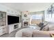 Inviting living room featuring a fireplace, large TV, and comfortable seating with water view at 6100 N Ocean Blvd. # 804, North Myrtle Beach, SC 29582