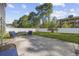 The backyard has a concrete patio with outdoor seating and a grassy area behind a vinyl fence at 650 Woodman Dr., Conway, SC 29526