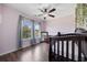 Charming Bedroom with soft pink walls, wood floors, ceiling fan, and scenic view at 650 Woodman Dr., Conway, SC 29526