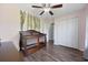 Cozy Bedroom with wood floors, a decorative wall vine, and double door closet at 650 Woodman Dr., Conway, SC 29526